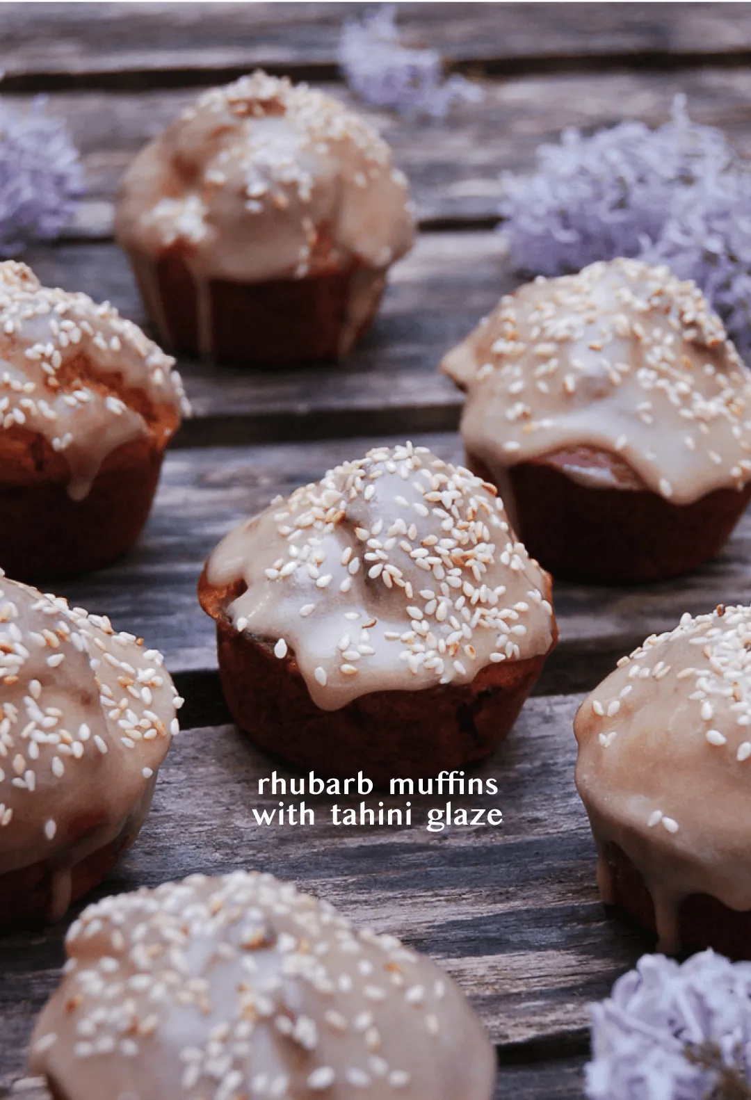 Rhubarb muffins with dripping tahini glaze and sesame seeds on dark wood, titled "rhubarb muffins with tahini glaze"