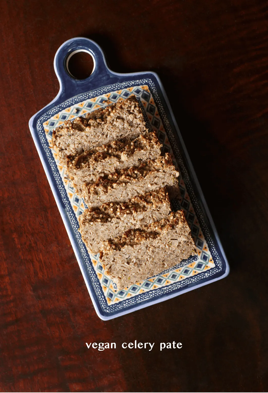Overhead shot of the vegan celery pâté sliced on the ceramic board